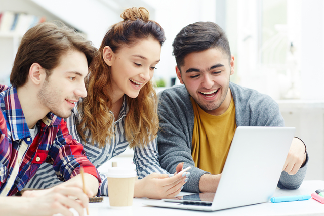 Happy learners video chatting with friends online