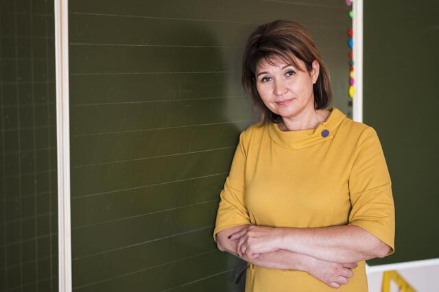 teacher with arms crossed